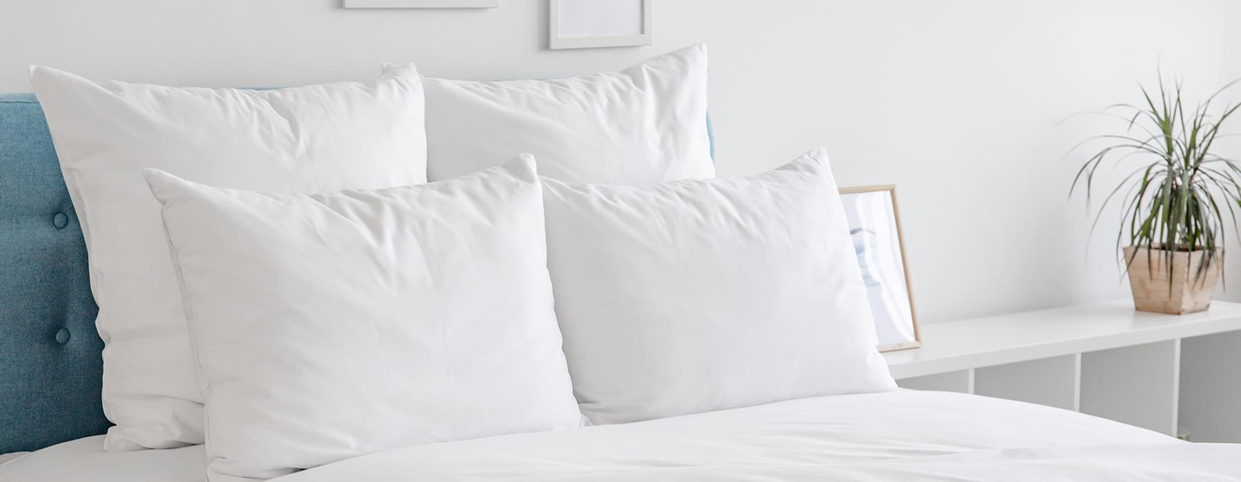 white and bright pillows and bed spread
